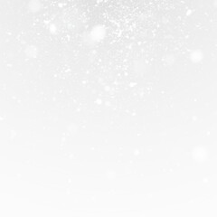 Christmas background with snow spray and sparkling frost.