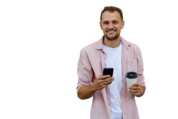 Young man smiling, holding smartphone and coffee cup, enjoying break, transparent background