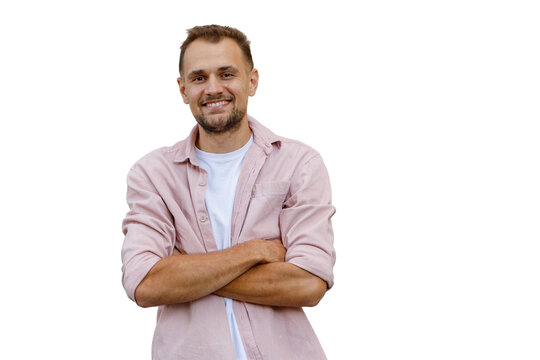 Confident young man smiling, arms crossed, wearing a casual pink shirt with transparent background