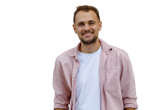 Young man smiling at camera, showing friendly and happy expression, standing in casual pink shirt with transparent background