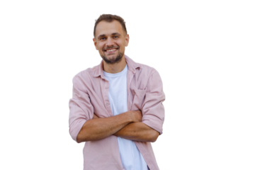 Smiling young man posing confidently, arms crossed, wearing a pink casual shirt and white t-shirt, on a transparent background