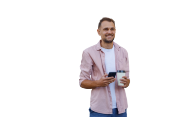 Young man smiling, standing with smartphone and coffee cup, enjoying break, technology and social connection concept