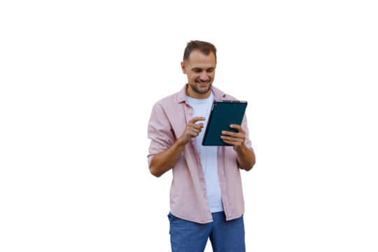 Man smiling while interacting with a tablet, engaging with modern technology. Transparent background