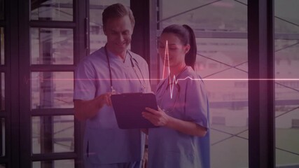 Animated ECG waveform appearing on glass guiding doctors reviewing health data, marking values - Powered by Adobe