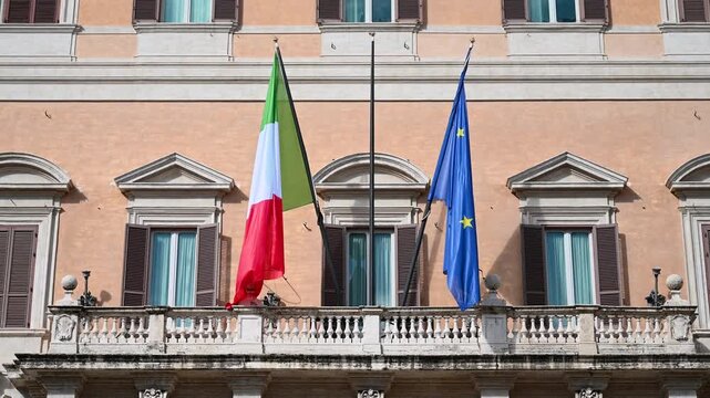 Rome, Italy: The building of the Italian Parliament. Flags of Italy and European Union. Parliament of the Republic of Italy. Palazzo Montecitorio, seat of Italian Chamber of Deputies.  