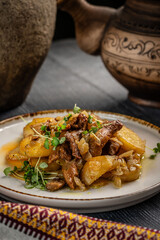 Fried potatoes with chanterelle mushrooms and herbs.