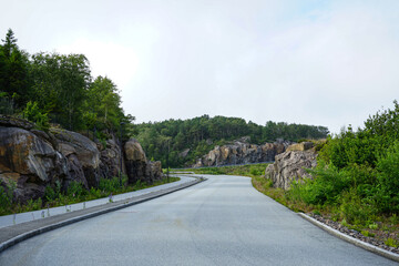 Road through rocks and forest.