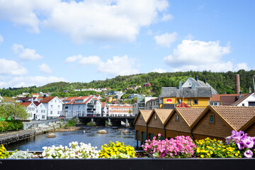 Scenic town view with colorful houses and river in Egersund, Norway.