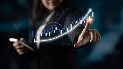 A professional businesswoman interacts with a digital stock market graph, showcasing financial trends and data analysis in a modern office setting. Impute