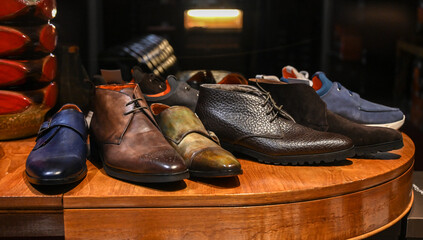 Men's leather shoes for sale in store. Shoes in the shop window.