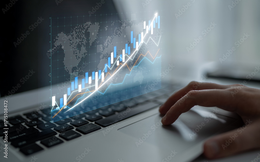 Poster a close-up of a hand on a laptop touchpad with financial charts and graphs projected, representing g