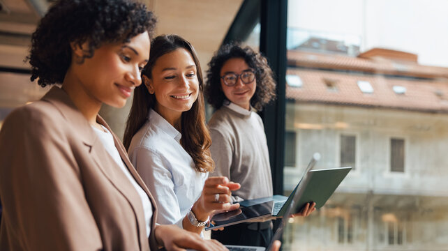 A diverse group of skilled professionals working together and brainstorming innovative ideas in a stylish workspace