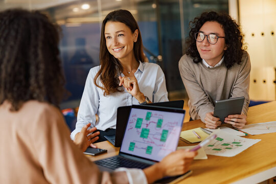 A dynamic team is engaging in a productive discussion about various digital planning tools and strategies