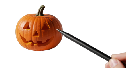 Carved pumpkin with a pen