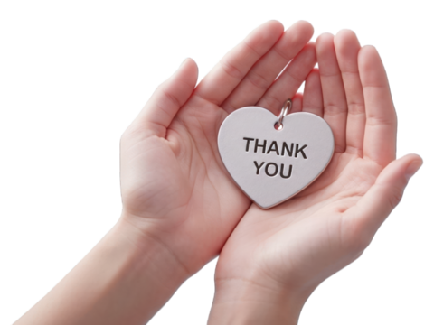 Child's hands hold a heart-shaped THANK YOU tag