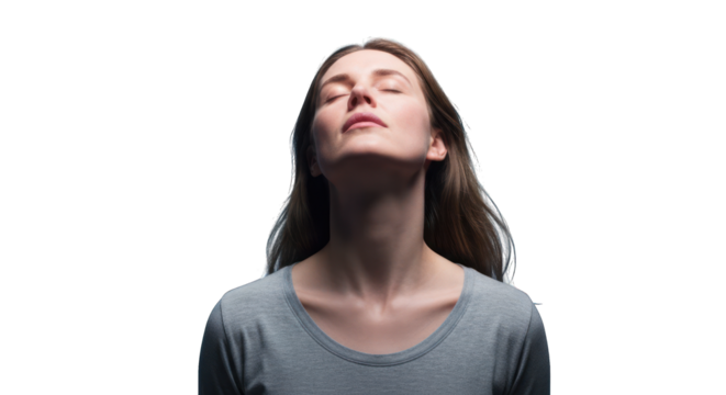 Close-up of a woman with eyes closed, head tilted back, in soft light