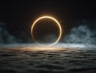 Glowing golden ring encircled by ethereal smoke and dust particles, hovering low above a dark textured surface.  The ring's light casts a subtle glow on the ground