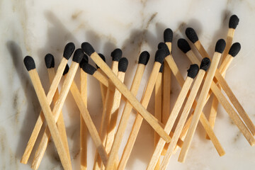 matches with black tips on a white background