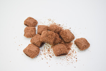 Crispy chocolate snacks on white background, sweet crunchy treats perfect for dessert, breakfast, or snack time