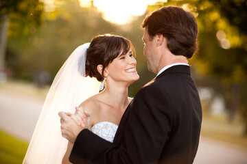 Happy Bride and Groom Slow Dancing Together Outside - Romantic Wedding Moment