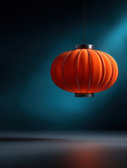 Obraz premium Bright orange lantern hanging against a blue backdrop