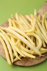 Fresh bean pods on green background, closeup