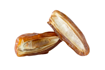Ripe dried date palm fruits in two halves in stack isolated with clipping path in png file format Concept of iftar food in Ramadan month for Muslims
