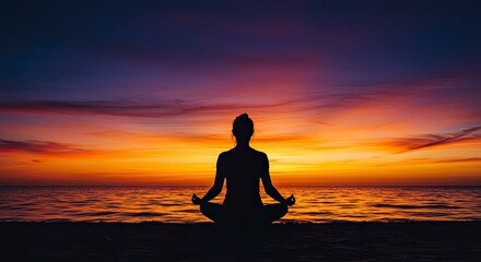 Fototapeta premium Serene Silhouette: Woman Meditating on Beach at Sunset with Vibrant Sky