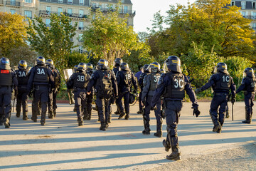 french anti riot police squad and Gendarmerie  marching during a strike