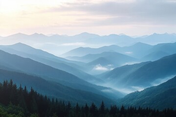 Obraz premium Peaceful layered mountain landscape with dense evergreen forests and soft mist under a pale sky at dawn