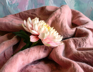 Soft Woolen Scarf with Pink Bloom Resting Amidst Gentle Folds