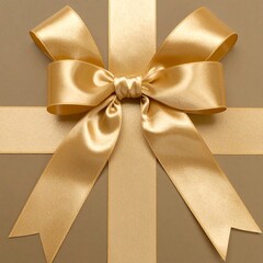 Gold ribbon bow on a taupe gift box