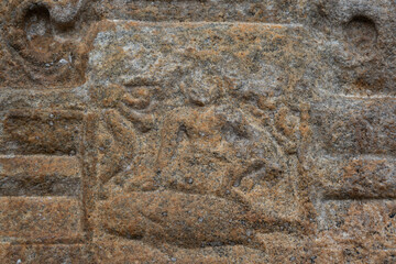 An ancient  sculpture of the Hindu god and goddess carved in stone