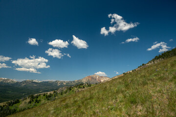 Grassy Slopes Leading Down Sepulcher Mountain with view of Electric Peak in Yellowstone