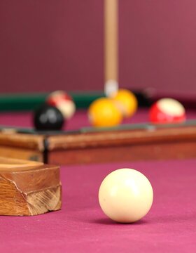 Pool table scene with cue ball