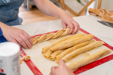 woman hands shaping a twist for a Babka