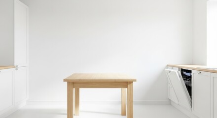 Modern kitchen interior featuring a light wood table and white cabinetry against a bright white wall.