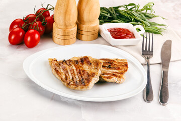 Grilled pork steak with sauce