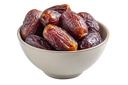 a bowl of dates on a white background