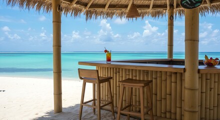 a open-air tiki bar on a white sand beach with two empty stools at the counter.The view is a clear blue ocean,the bar is decorated with simple bamboo,tropical flowers.The light is bright ,sunny.