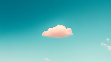 Soft pink cloud floating in a clear blue sky with hints of white clouds