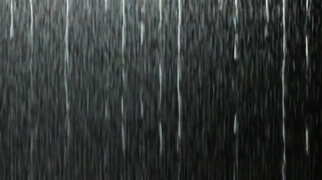 Rainfall on a Black Background. Rain Falling Animation. 4K