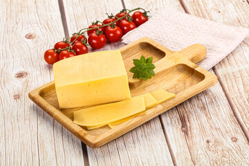 Yellow cheese piece with slices