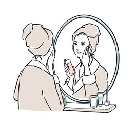 鏡の前に立つバスローブ姿の女性　スキンケア