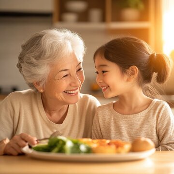 Joyful Moments of Grandmother and Granddaughter at the Dinner Table