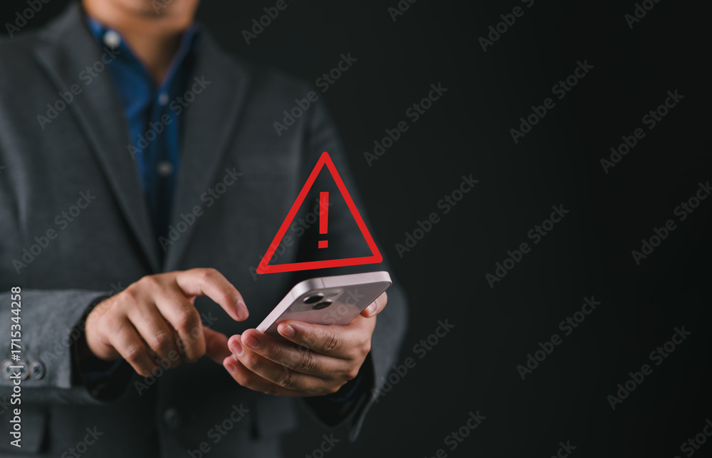 Poster system warning hacked alert, cyber attack on computer network.businessperson using smartphone with w