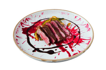 Gourmet Dish: A succulent, medium-rare steak is artfully arranged atop a patterned plate. The dish exudes culinary excellence