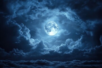 Fototapeta premium Bright full moon shining through dense dark clouds in a dramatic night sky