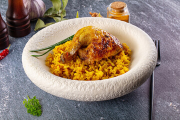 Roasted chicken leg with yellow rice