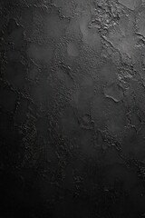 close-up image of dark textured rough surface with uneven patches and cracks creating abstract patterns